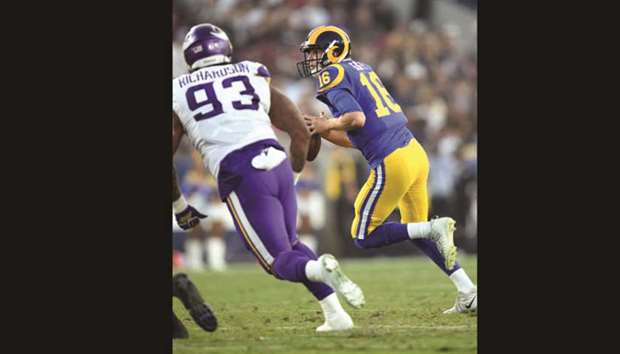Los Angeles Rams quarterback Jared Goff (right) runs the ball during the game against Minnesota Vikings Los Angeles Memorial Coliseum on Thursday. (USA TODAY Sports)