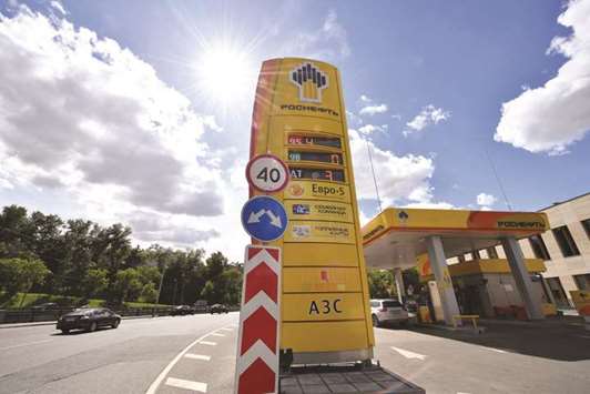 The logo of Russiau2019s oil giant Rosneft is seen at a petrol station in Moscow (file). As US lawmakers mull a new round of u201ccripplingu201d sanctions, some traders are predicting the price of Russiau2019s main export will hit $100 a barrel for the first time since 2014.