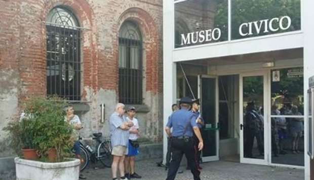 Police outside the museum after the attack