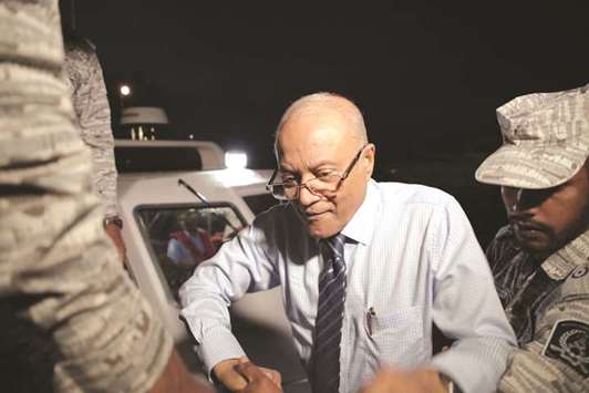 Maumoon Abdul Gayoom, disembarks from a boat coming from the custodial island of Dhoonidhoo to attend a hearing at the High Court of Maldives in Male yesterday.