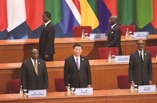 Chinau2019s President Xi Jinping (front centre) stands as participants arrive for the opening ceremony of the Forum on China-Africa Co-operation at the Great Hall of the People in Beijing yesterday. Xi offered $60bn to Africa at the start of a two-day China-Africa summit that focused on his cherished Belt and Road initiative.