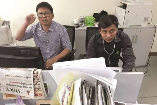 In this file photo, Reuters journalists Wa Lone, left, and Kyaw Soe Oo, who are based in Myanmar, pose for a picture at the Reuters office in Yangon.