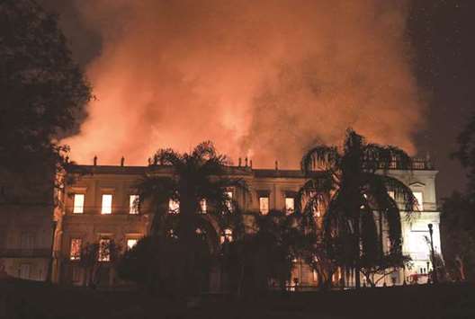 Flames light up the night sky after a massive fire engulfed the National Museum in Rio de Janeiro.