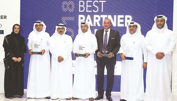 HE the Qatar Central Bank Governor Sheikh Abdullah bin Saoud al-Thani and QDB executive director of Business Finance Khalid Abdulla al-Mana flank the awardees u2013 QIIB CEO Dr Abdulbasit Ahmad al-Shaibei, al khaliji Group CEO Fahad Abdullah al-Khalifa, QIB CEO Bassel Gamal, and QNB general manager for Group Corporate and Institution Banking Yousef Mahmoud al-Neama. PICTURE: Ram Chand