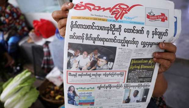 A Myanmar newspaper displays the story about the sentences received by Reuters journalists Wa Lone and Kyaw Soe Oo, on its front page.
