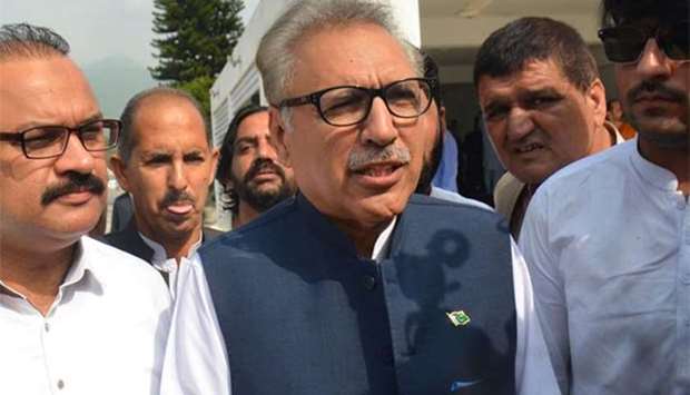 Leader of ruling Pakistan Tehreek-e-Insaf (PTI) party and presidential candidate Arif Alvi arrives at the National Assembly in Islamabad on Tuesday.