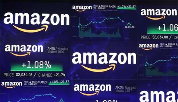 The Amazon.com logo and stock price information is seen on screens at the Nasdaq Market Site in New York City on Tuesday.