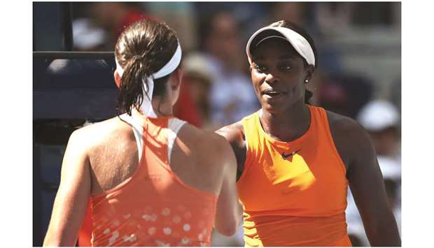 Sloane Stephens (right) and Anastasija Sevastova (left) shake hands following their match yesterday. (AFP)