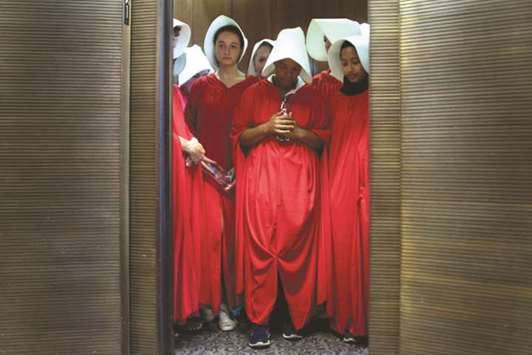 Women dressed as characters from the novel-turned-TV series The Handmaidu2019s Tale stand in an elevator at the Hart Senate Office Building as Supreme Court nominee Brett Kavanaugh starts the first day of his confirmation hearing at the US Senate on Capitol Hill in Washington, DC.