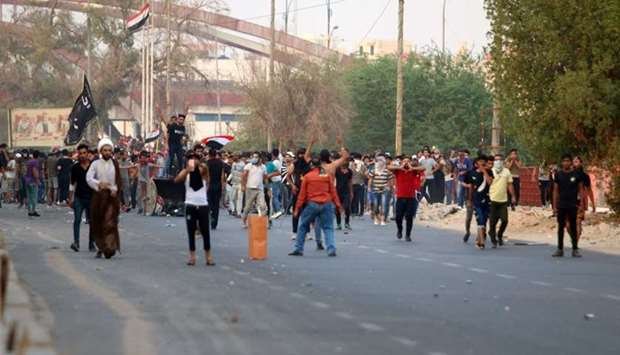 Protesters clash with Iraqi forces following the funeral of a man yesterday, whose family and Human rights activists claim he was killed by bullet shots during the previous day, while demonstrating against the government and the lack of basic services, in the southern city of Basra.