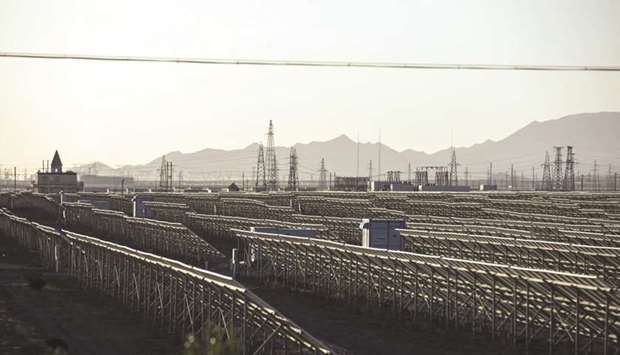 Photovoltaic panels stand at a power station at the Golmud Solar Park on the outskirts of Golmud, Qinghai province. Conflict over Chinau2019s industrial policies is at the centre of a trade war thatu2019s set to escalate should President Donald Trump go ahead with planned tariffs on another $200bn of Chinese goods as soon as this week.