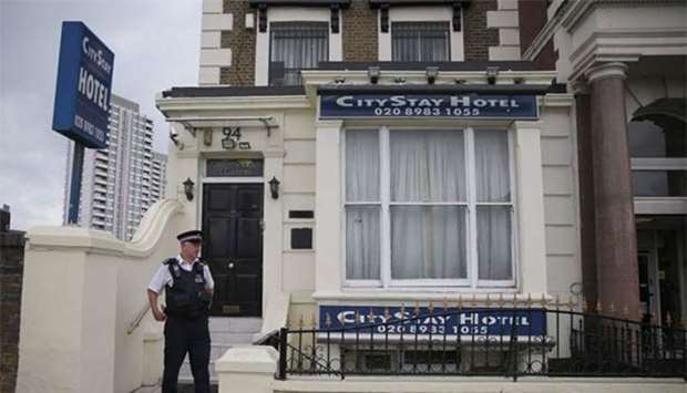 A police officer stands outside the City Stay Hotel, where Russian suspects Alexander Petrov and Ruslan Boshirov stayed, in Bow, east London, on Wednesday.
