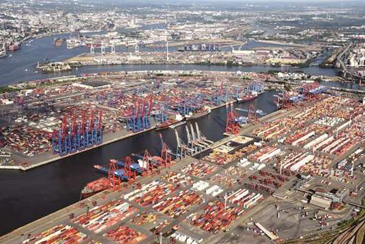 An aerial view of containers at a loading terminal in the port of Hamburg. German industrial orders fell unexpectedly in July on weak foreign demand, data showed  yesterday, in a further sign that factories in Europeu2019s largest economy are feeling the bite of US President Donald Trumpu2019s protectionist trade policies.