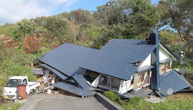 A house damaged by a landslide caused by an earthquake is seen in Atsuma town in Hokkaido prefecture.