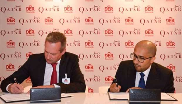 QTA and DER Touristik Deutschland officials signing the agreement in Berlin.