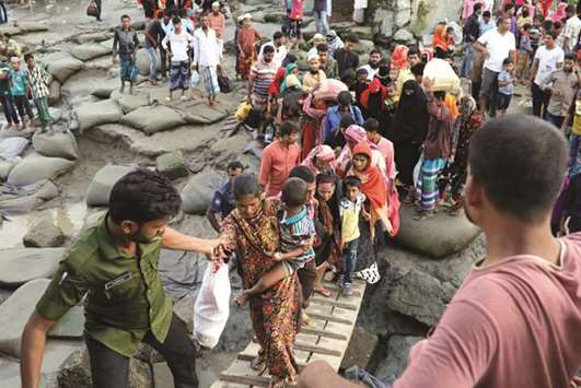 People get into a passenger ferry as they travel to Dhaka in south-central district of Bhola yesterday. Bhola Island, 116km from capital Dhaka, is the largest island of Bangladesh.