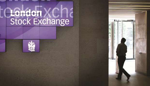 A man walks to the lifts inside the London Stock Exchange (file). The FTSE 100 closed down 0.6% to 7,277.70 points yesterday.