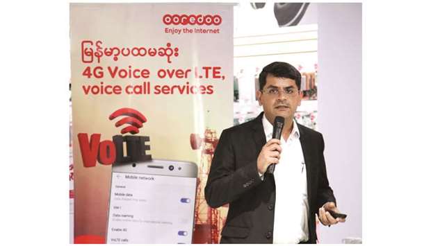 An official during the technology showcase at Ooredoo Myanmaru2019s flagship store in Myanmar Plaza.