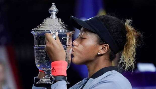 Naomi Osaka kisses the US Open trophy after beating Serena Williams in the womenu2019s final of the 2018 US Open tennis at USTA Billie Jean King National Tennis Center.