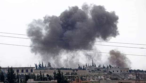 Smoke billows following Syrian government forces\' bombardment around the town of Al Habit on the southern edges of the rebel-held Idlib province on Sunday.