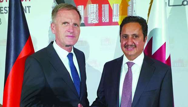 Muzel (left) and Qatar Chamber chairman Sheikh Khalifa bin Jassim al-Thani shake hands on the sidelines of a gala dinner for the '9th Qatar-German Business and Investment Forum'. PICTURE: Peter Alagos
