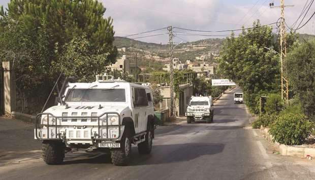 Vehicles of United Nations Interim Forces in Lebanon (UNIFIL) ride on a road along the border between Lebanon and Israel in the southern Lebanese town of Ramyeh in the Bint Jbeil District, yesterday.