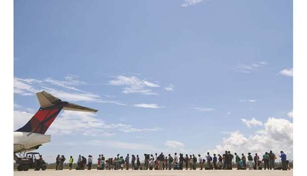 Residents line-up for evacuation from the Great Abaco island at the airport in Marsh Harbour.