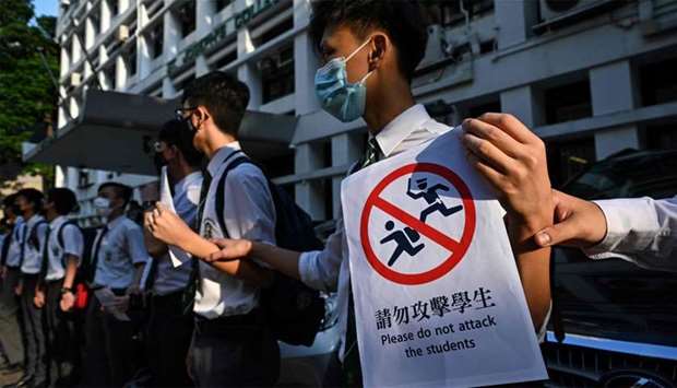 Students take part in a joint u2018school human chain rallyu2019 in Hong Kong