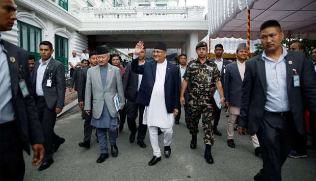 Nepal's Prime Minister Khadga Prasad Sharma Oli, also known as K.P. Oli, smiles as he walks out after the inauguration of the Motihari-Amlekhganj petroleum pipeline project at Singha Durbar, in Kathmandu