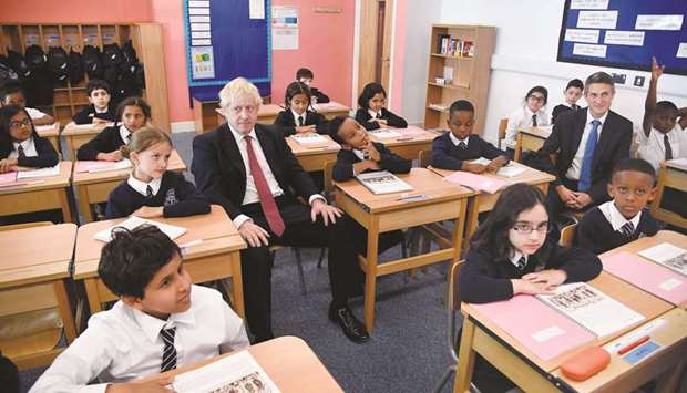 Prime Minister Boris Johnson and Secretary of State for Education Gavin Williamson attend a year four history class with pupils during a visit to Pimlico Primary school in London yesterday.
