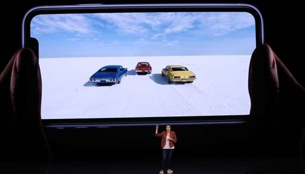 Apple's Kaiann Drance talks about the new iPhone 11 during a special event in the Steve Jobs Theatre on Apple's Cupertino, California campus. Apple unveiled its iPhone 11 models, touting upgraded, ultra-wide cameras as it updated its popular smartphone lineup and cut its entry price to $699.