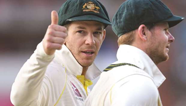 Australiau2019s captain Tim Paine (left) gestures beside Steve Smith as they celebrate their victory on the field after the fourth Ashes cricket Test match on Sunday. (AFP)