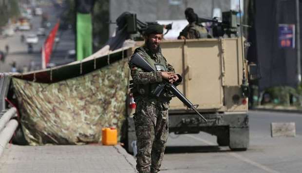 An Afghan National Army (ANA) soldier stands guard at a check point in Kabul