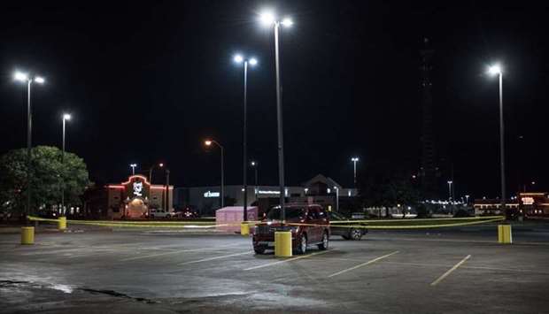 Police tape marks the scene outside a Twin Peaks restaurant after multiple people were shot yesterday in Odessa, Texas