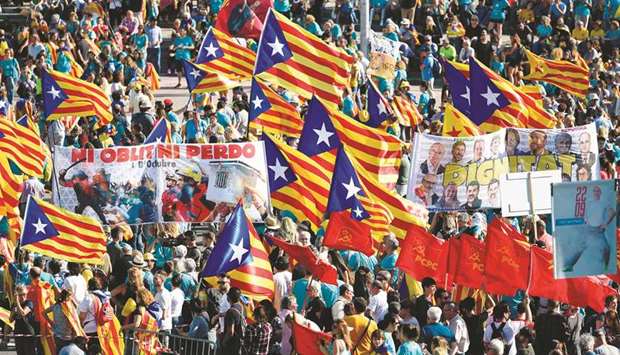 People wave Catalan pro-independence Estelada flags during a demonstration in Barcelona marking the u2018Diadau2019, the national day of Catalonia.
