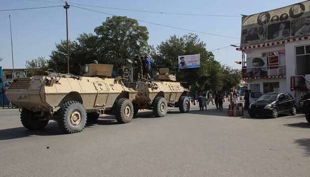 Afghan soldiers gather at a street in Kunduz yesterday