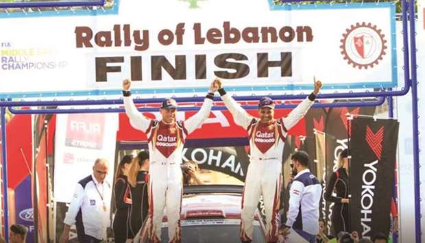 Qataru2019s Nasser al-Attiyah (right) and his French co-driver Mathieu Baumel celebrate after winning the 42nd edition of the 2019 Rally of Lebanon yesterday.