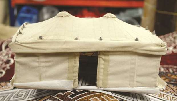 A miniature model of a tent displayed in a shop.