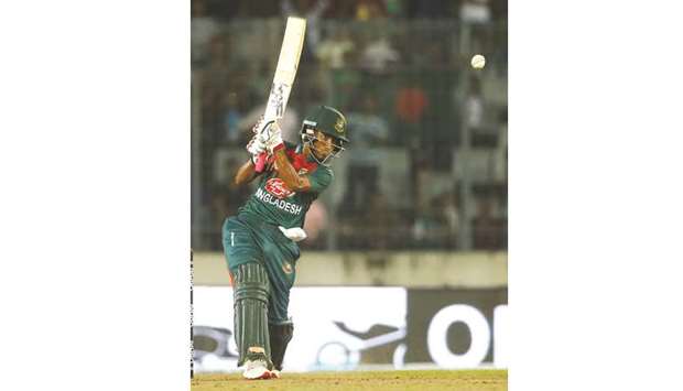 Afif Hossain of Bangladesh plays a shot against Zimbabwe in the Tri-nations cup T20  series in Dhaka yesterday.
