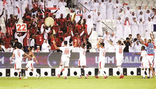 Al Arabi players celebrate with their supporters after they beat Umm Salal in the QNB Stars League at Jassim Bin Hamad Stadium.