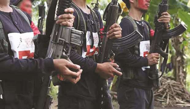 New Peopleu2019s Army fighters are seen during the Communist Party of the Philippinesu2019 50th anniversary.