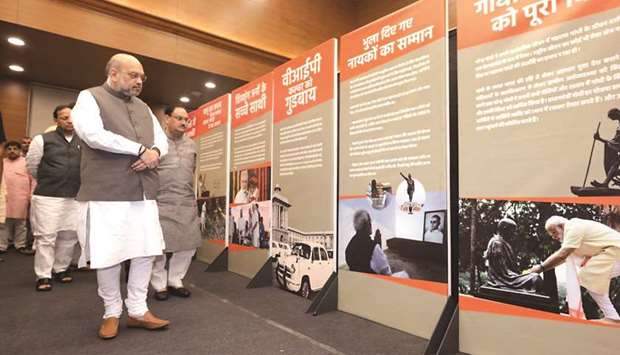 Home Minister Amit Shah and Bharatiya Janata Party working president J P Nadda attend an exhibition on the life and works of Prime Minister Narendra Modi, at the party headquarters in New Delhi yesterday.