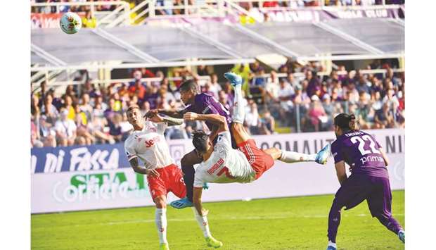 Juventusu2019 forward Cristiano Ronaldo performs an overhead kick during the Italian Serie A match against Fiorentina at the Artemio-Franchi stadium in Florence yesterday. (AFP)
