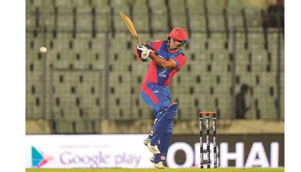 Afghanistanu2019s Najibullah Zadran in action during the second match of the T20 tri-nations series against Zimbabwe in Dhaka yesterday. (AFP)