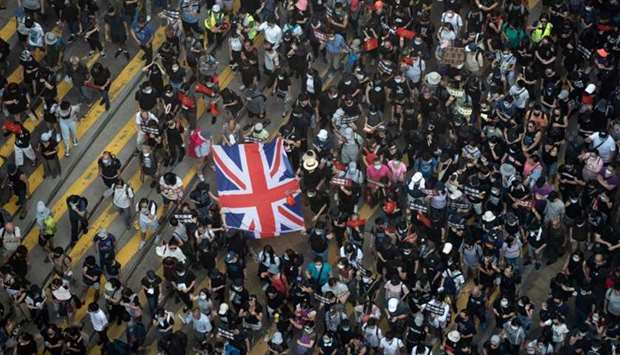 Protesters attend a pro-democracy march in the Casueway Bay district of Hong Kong