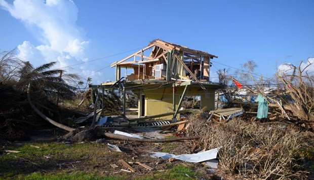 Debris lies around a damaged home in the aftermath of Hurricane Dorian in Treasure Cay on Abaco island, Bahamas. File photo taken on September 11, 2019