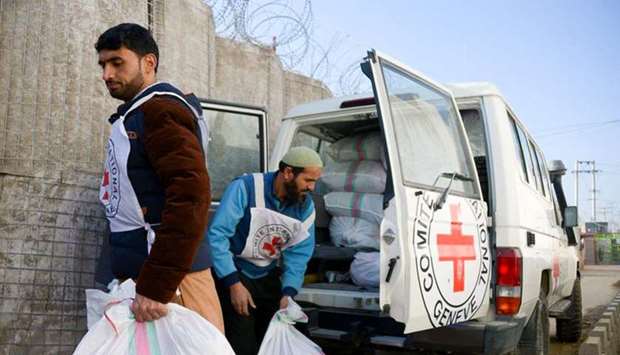 Two Red Cross workers prepare to distribute goods to detainees at a provincial prison in Afghanistan. File picture: Farshad Usyan/ICRC