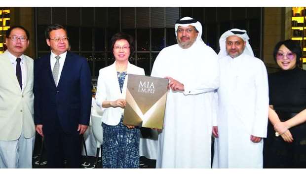 Gulf Times Editor-in-Chief Faisal Abdulhameed al-Mudahka presents a memento to Minister HE Yin Yicui