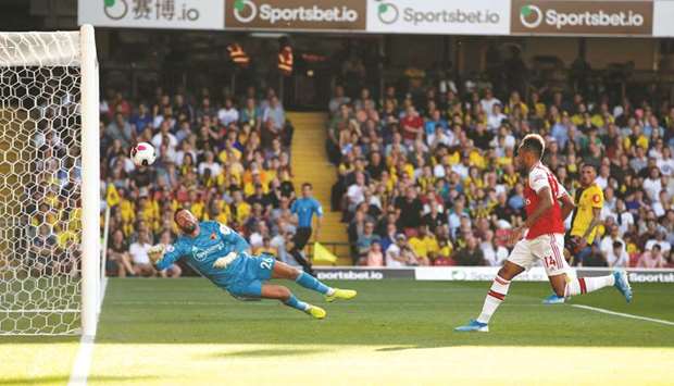 Arsenalu2019s Pierre-Emerick Aubameyang scores against Watford during the Premier League match at Vicarage Road in Watford, Britain. (Reuters)
