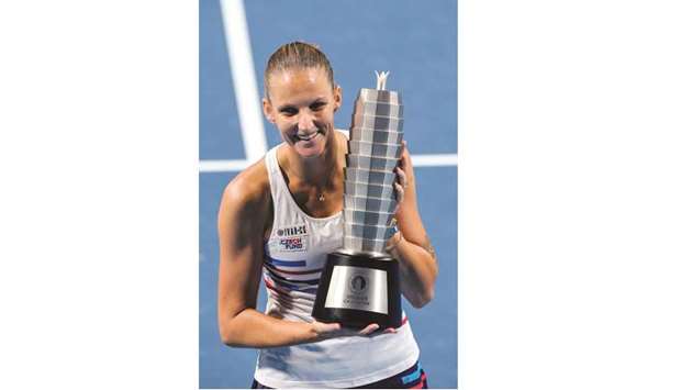 Karolina Pliskova holds the trophy after winning the final match against Petra Martic at the Zhengzhou Open yesterday. (AFP)
